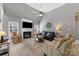 Comfortable living room featuring a fireplace, ceiling fan, and ample seating for a cozy and inviting atmosphere at 6002 Sentinel Dr, Indian Trail, NC 28079