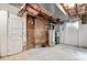 Unfinished basement featuring exposed brick, concrete floor and utilities, offering potential for storage or customization at 625 4Th Street Nw Dr, Hickory, NC 28601
