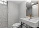 Modern bathroom featuring a unique sink, stylish mirror, and exposed brick, offering a blend of contemporary design at 625 4Th Street Nw Dr, Hickory, NC 28601