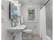Fresh bathroom featuring a pedestal sink, new fixtures, and shower/tub combo at 625 4Th Street Nw Dr, Hickory, NC 28601