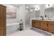 Beautiful bathroom featuring a soaking tub, glass shower, and wood cabinet vanity with double sinks at 625 4Th Street Nw Dr, Hickory, NC 28601