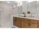 Bathroom features double vanity with marble countertop and glass enclosed shower at 625 4Th Street Nw Dr, Hickory, NC 28601
