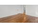 Spacious bedroom with hardwood floors features a doorway leading to the bathroom at 625 4Th Street Nw Dr, Hickory, NC 28601