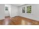 Inviting bedroom featuring windows offering bright natural light and beautiful wood floors at 625 4Th Street Nw Dr, Hickory, NC 28601