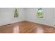 Sunny bedroom with hardwood floors and two bright windows at 625 4Th Street Nw Dr, Hickory, NC 28601