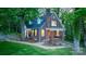 Charming brick home featuring manicured lawn, covered porch, and mature trees, perfect for serene living at 625 4Th Street Nw Dr, Hickory, NC 28601