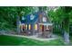 Charming brick home with a covered porch, manicured lawn, and mature trees, offering classic curb appeal at 625 4Th Street Nw Dr, Hickory, NC 28601