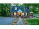 Inviting brick home showcasing a neatly landscaped front yard, classic architecture, and a welcoming entrance at 625 4Th Street Nw Dr, Hickory, NC 28601