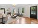 Bright and airy living room with hardwood floors, fireplace, and large windows offering ample natural light at 625 4Th Street Nw Dr, Hickory, NC 28601