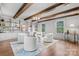 Bright living room with wood floors, exposed beams, custom built-ins, and contemporary accent chairs at 625 4Th Street Nw Dr, Hickory, NC 28601