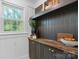 Pantry with dark cabinets, butcher block counters, and natural light from the window at 625 4Th Street Nw Dr, Hickory, NC 28601