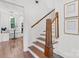 Staircase with craftsman details and natural light looking into a breakfast nook at 625 4Th Street Nw Dr, Hickory, NC 28601
