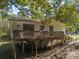 A back deck with room for grilling and outdoor relaxation is accessible from the main living area at 6312 Bill Ledford Rd, Vale, NC 28168