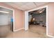 Basement room view showing the access to another room with exposed pipes at 6312 Bill Ledford Rd, Vale, NC 28168
