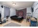 Bedroom featuring desk area, tv and modern interior design with natural lighting at 6312 Bill Ledford Rd, Vale, NC 28168