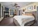 Spacious bedroom with wood floors, fire place and a large ceiling fan at 6312 Bill Ledford Rd, Vale, NC 28168