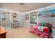 Bright bedroom with light wood floors, a window, decorated walls, and a cute vanity at 6312 Bill Ledford Rd, Vale, NC 28168