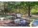 This outdoor stone fire pit offers a peaceful setting for entertaining on cool evenings at 6312 Bill Ledford Rd, Vale, NC 28168