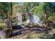 A stone fire pit, in a natural setting, creates an intimate outdoor area for relaxing and enjoying time with friends at 6312 Bill Ledford Rd, Vale, NC 28168