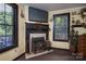Bedroom with a fireplace featuring decorative elements and a television mounted above at 6312 Bill Ledford Rd, Vale, NC 28168