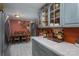 Kitchen leading to a dining area with stainless steel refrigerator and tile countertops at 6312 Bill Ledford Rd, Vale, NC 28168