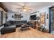 Comfortable living room with a large sectional sofa, decorative accents, and a ceiling fan for added comfort at 6312 Bill Ledford Rd, Vale, NC 28168