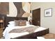 Comfortable bedroom features designer walls, a fur throw blanket, and modern furnishings at 715 N Church St # 816, Charlotte, NC 28202