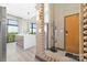 Welcoming entryway with a view of the open-concept kitchen and stainless steel appliances at 715 N Church St # 816, Charlotte, NC 28202