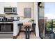 Bright condo work space features stainless appliances, modern desk, and balcony with a view at 715 N Church St # 816, Charlotte, NC 28202