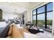 Open concept living space boasts large windows, modern decor, and a well-equipped kitchen at 715 N Church St # 816, Charlotte, NC 28202