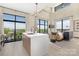 Bright living room with large windows and modern decor, featuring a kitchen island and balcony with city views at 715 N Church St # 816, Charlotte, NC 28202