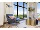 Comfortable sitting area with a great view boasts a modern chair, decor, and large windows at 715 N Church St # 816, Charlotte, NC 28202
