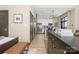 Open-concept living space with modern furniture and stainless steel appliances at 715 N Church St # 816, Charlotte, NC 28202