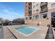 Exterior view of a compact community pool area within a condominium complex at 715 N Church St # 816, Charlotte, NC 28202