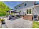 Backyard featuring patio with a gazebo, brick steps, and a view of the home at 7300 Chatterbird Ct, Charlotte, NC 28226