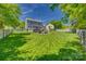 This property boasts a spacious, fully fenced backyard with a well-maintained lawn and patio at 7300 Chatterbird Ct, Charlotte, NC 28226