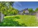 Large grassy backyard with gazebo, surrounded by privacy fence at 7300 Chatterbird Ct, Charlotte, NC 28226