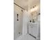 Bright bathroom featuring a shower-tub combo and a sleek white vanity at 7300 Chatterbird Ct, Charlotte, NC 28226