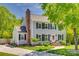Charming two-story home with a brick chimney, well-maintained lawn, and inviting landscaping at 7300 Chatterbird Ct, Charlotte, NC 28226