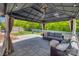 Gazebo with outdoor seating, ceiling fan, and backyard view at 7300 Chatterbird Ct, Charlotte, NC 28226