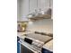 Contemporary kitchen with a stainless steel oven, subway tile backsplash, and sleek range hood at 7300 Chatterbird Ct, Charlotte, NC 28226