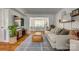 Bright, open living room connects to the dining area, with stylish decor and ample natural light at 7300 Chatterbird Ct, Charlotte, NC 28226