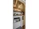 Organized pantry with wooden shelves, filled with kitchen essentials and appliances at 7300 Chatterbird Ct, Charlotte, NC 28226