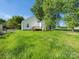 Exterior view of the house and large backyard with green grass at 803 Blackmon St, Rock Hill, SC 29730