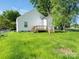 Exterior view of the house and large backyard with green grass at 803 Blackmon St, Rock Hill, SC 29730