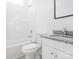 A bathroom features a tub, toilet, granite countertop, and vanity at 803 Blackmon St, Rock Hill, SC 29730