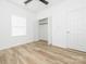 A bright bedroom features vinyl floors, a ceiling fan, and a closet at 803 Blackmon St, Rock Hill, SC 29730