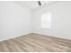 An empty bedroom displays a neutral color palette and vinyl flooring at 803 Blackmon St, Rock Hill, SC 29730