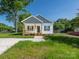 Charming single-story home with a cozy front porch and fresh landscaping at 803 Blackmon St, Rock Hill, SC 29730
