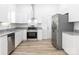 Modern kitchen with stainless steel appliances, granite countertops, and ample cabinet space at 803 Blackmon St, Rock Hill, SC 29730